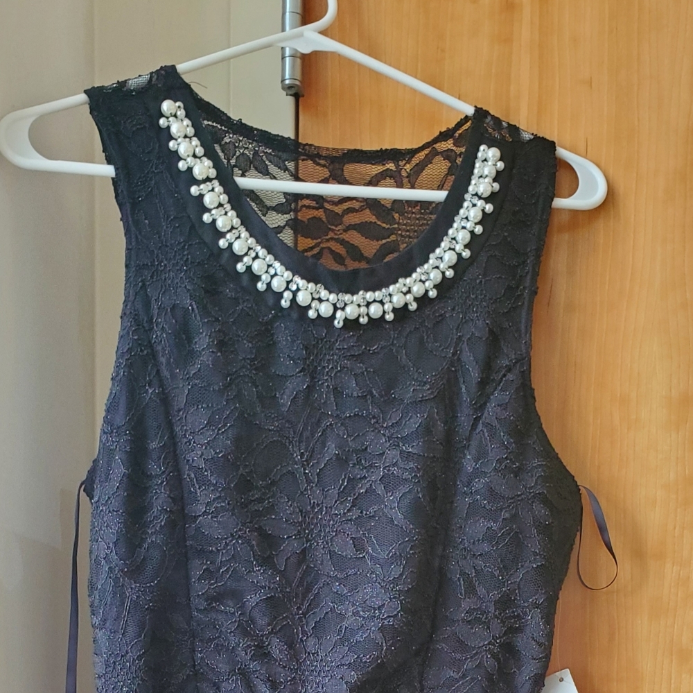 Black mini dress with white collar pearls
